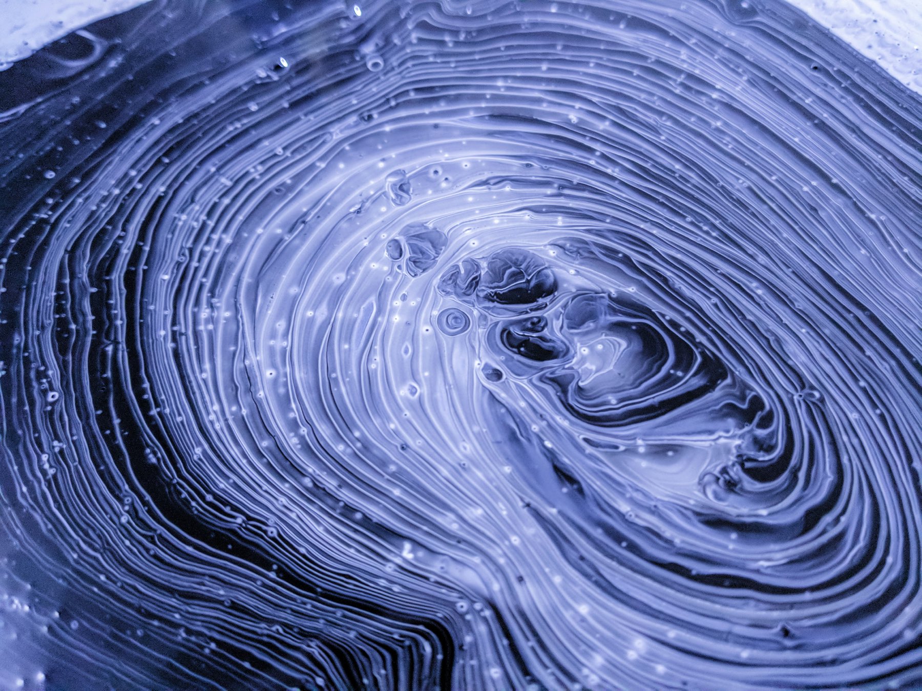 Abstract layered blue artwork representing multidisciplinary design